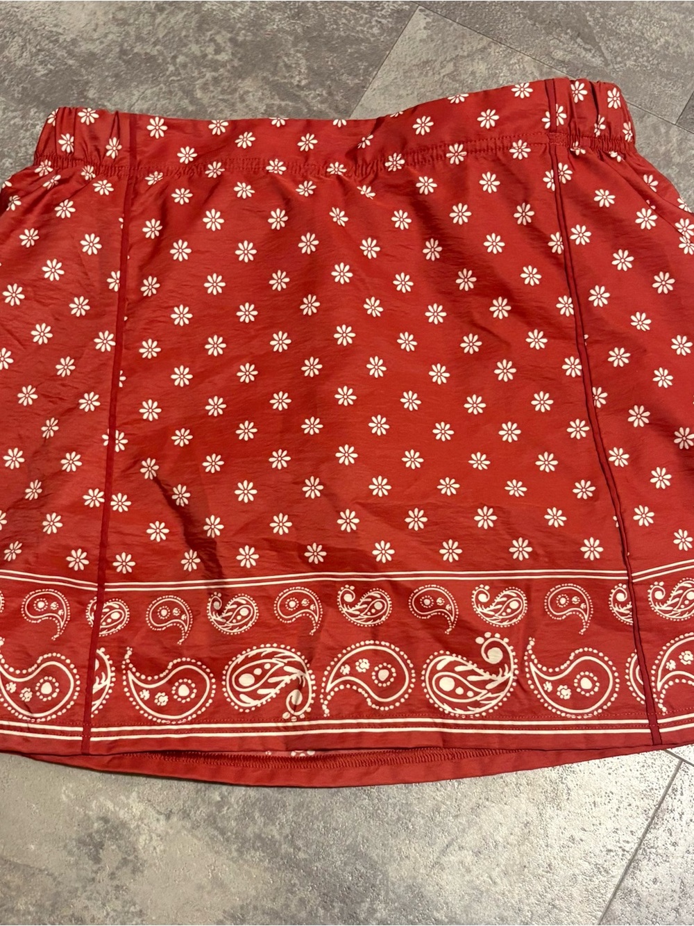 Women's orangish terracotta colored A-Line Skort with White Floral Motif